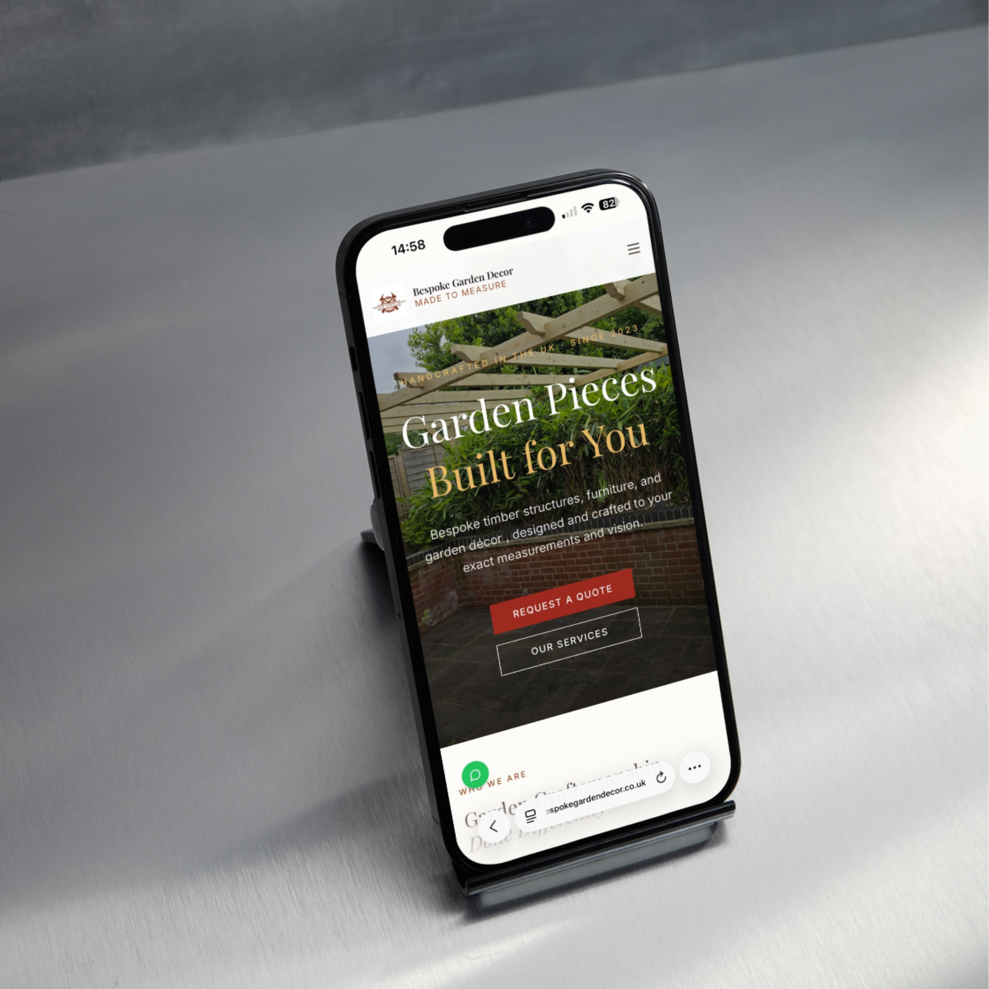 Bespoke Garden Decor — the homepage on a phone, its quote and services actions over a finished pergola